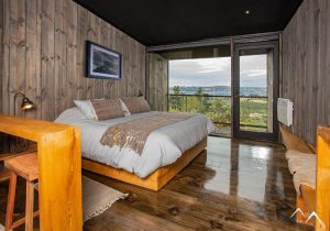 Chambre hôtel Estancia Rilán vue sur lacs Chili